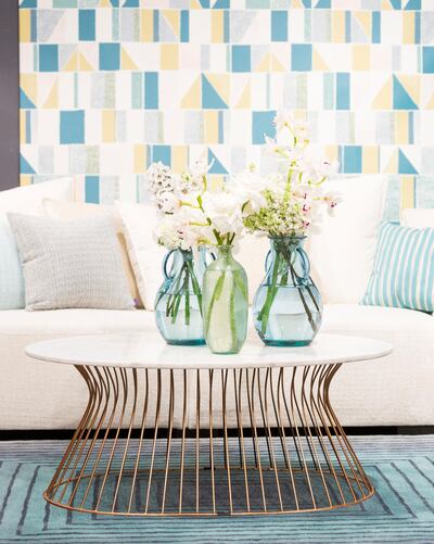 Repeat shapes, colours and patterns throughout the room. Courtesy aura