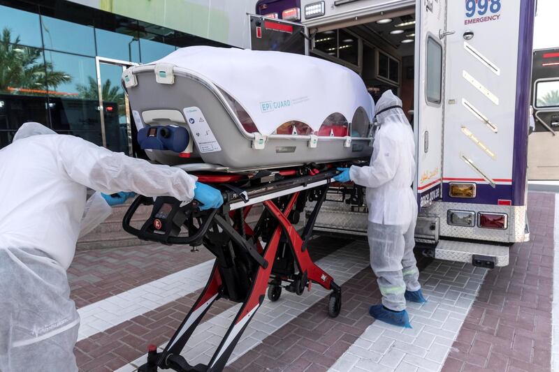DUBAI, UNITED ARAB EMIRATES. 23 APRIL 2020. Paramedics with the new Ambulance Capsules for transporting COVID 19 patients at the head quarters of Dubai Ambulance Corporation on Al Aweer Road. (Photo: Antonie Robertson/The National) Journalist: Haneen Al Amir. Section: Businessl.