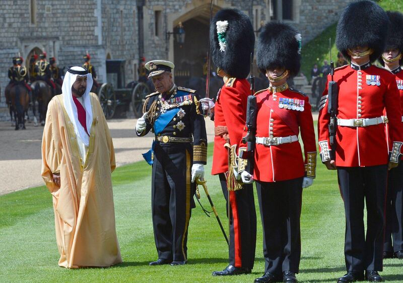 Britain's Prince Philip (2nd L) speaks to the President of the United Arab Emirates Sheikh Khalifa bin Zayed bin Sultan Al Nahyan (L) as they prepare to review an honour guard during a ceremonial welcome at Windsor Castle, in Windsor, southern England April 30, 2013. The President is paying a state visit to Britain from April 30 to May 1.   REUTERS/Toby Melville   (REUTERS - Tags: ENTERTAINMENT POLITICS SOCIETY ROYALS) *** Local Caption ***  TOB003_BRITAIN-_0430_11.JPG