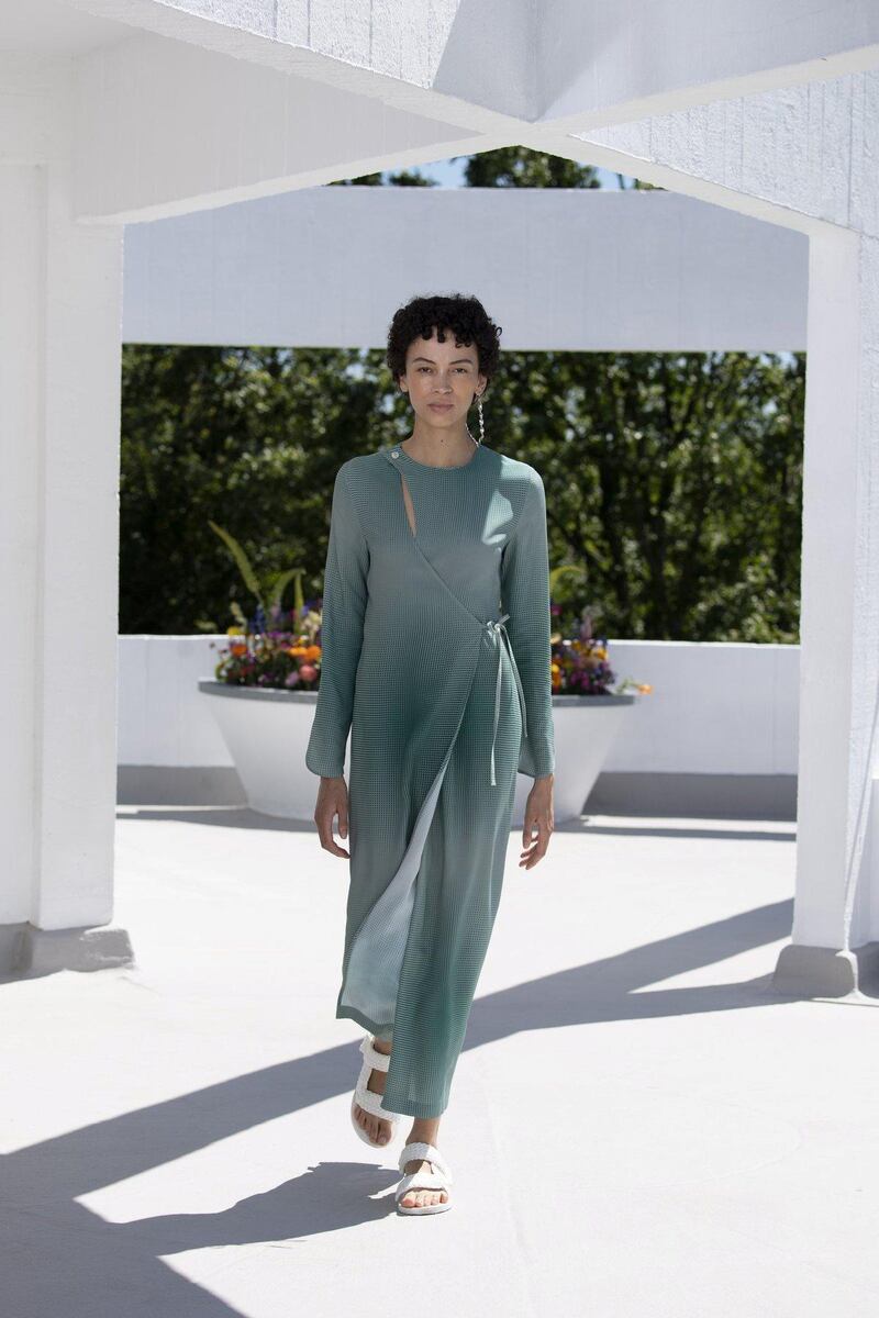 A simple wrap dress in a shifting grey tone, for the Qasimi spring / summer 2022 collection. Courtesy Qasimi