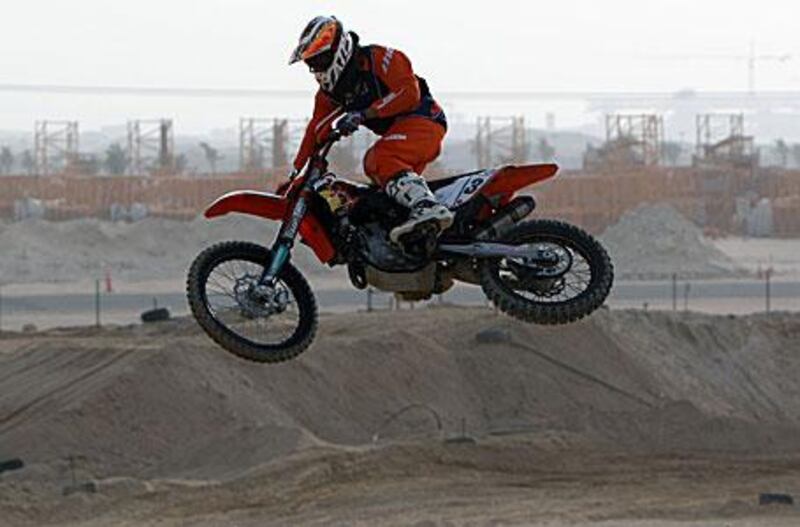The British motocross rider Sam Sunderland, who was offered a sponsorship deal by the bike manufacturer KTM while visiting relatives in the UAE, rides the circuit at the Motorcross Park in Jebel Ali.