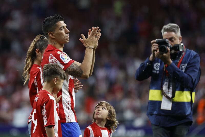 Luis Suarez, accompanied by his family, bids farewell to Atletico supporters. EPA