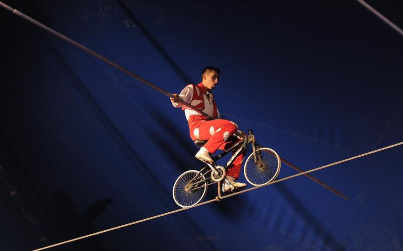 Cycling on a tightrope suspended in mid air. Courtesy Abu Dhabi Municipality