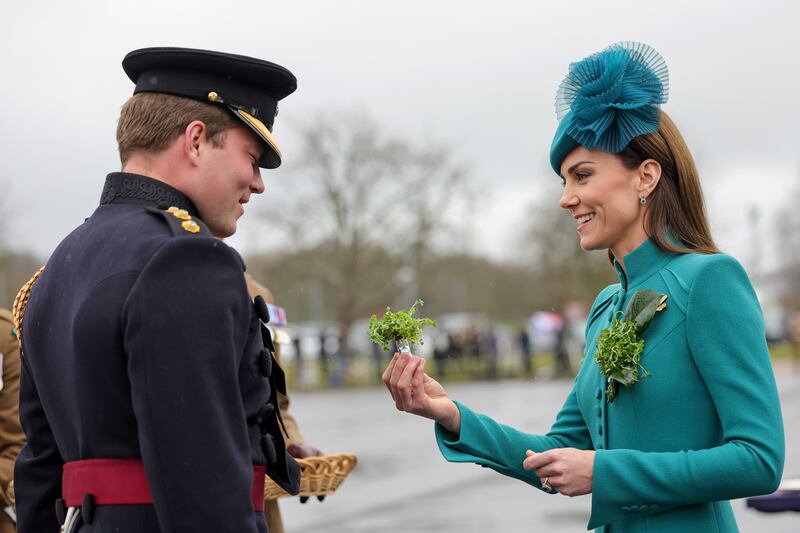 The Princess of Wales presents the traditional sprigs of shamrock to officers and guardsmen. PA