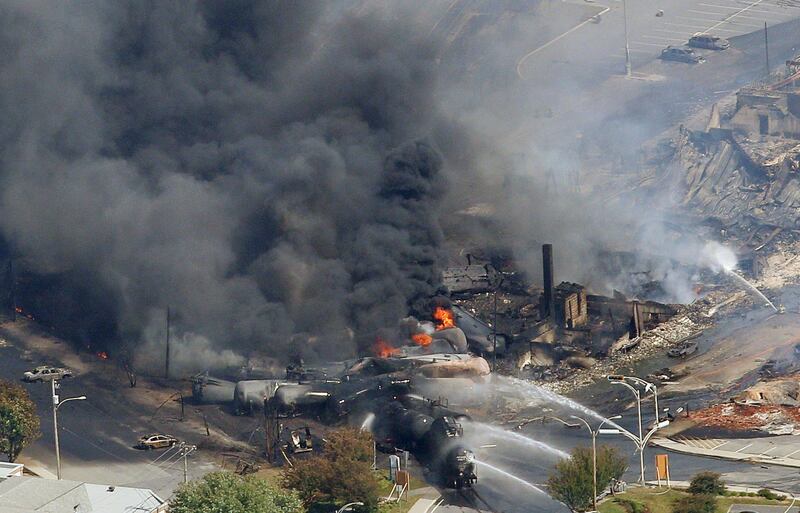 The wreckage of a train is pictured after an explosion in Lac Megantic July 6, 2013. Several people were missing after four tank cars of petroleum products exploded in the middle of a small town in the Canadian province of Quebec early on Saturday in a fiery blast that destroyed dozens of buildings.  REUTERS/Mathieu Belanger (CANADA - Tags: DISASTER ENERGY) *** Local Caption ***  QUE13_CANADA-TRAIN-_0706_11.JPG