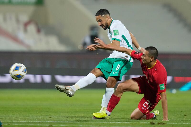 Saudi Arabia's Hatan Babhir shoots under pressure from China's Bin Bin Liu. AP 