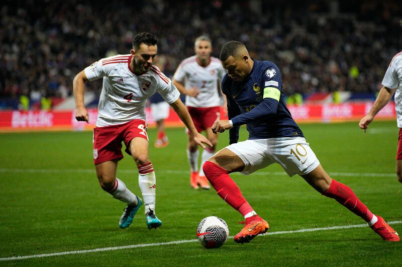 France's Kylian Mbappe, centre, in action. AP