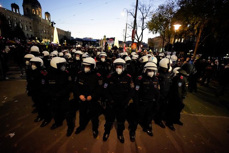 Police officers prepare to tackle anti-lockdown protesters in the Austrian capital. AP Photo