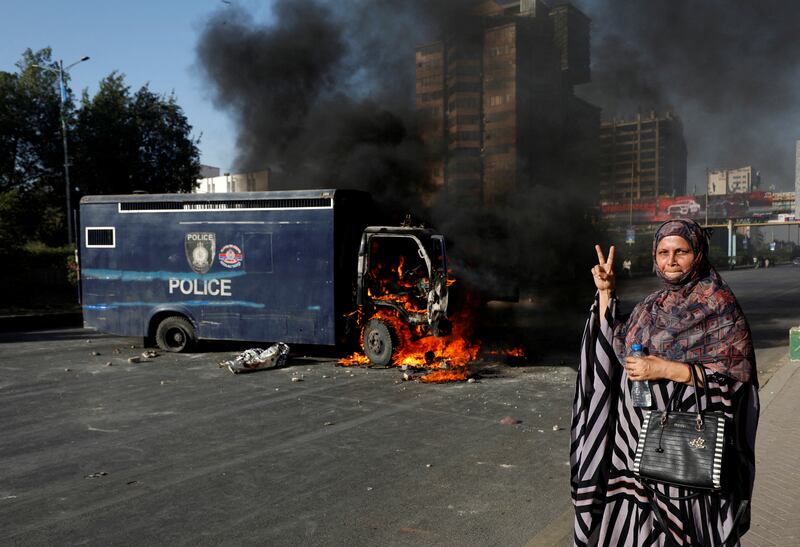 A burning police vehicle during a protest. Reuters