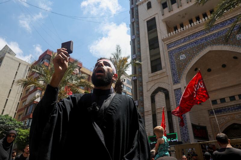 A Lebanese man takes part in  a demonstration in Beirut called by Hezbollah to condemn the desecration of the Quran in Sweden. Reuters