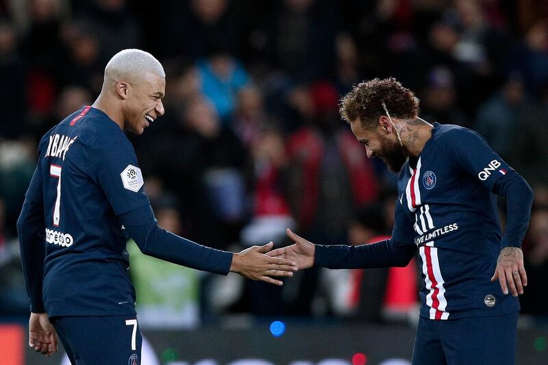 Mbappe celebrates with teammate Neymar  after PSG'ds third goal. EPA