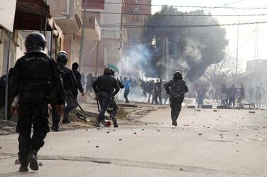 Tunisian riot police clash with protesters during demonstrations in Kasserine on December 25, 2018. Reuters