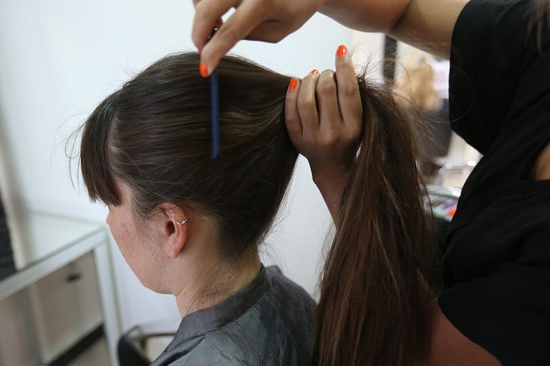 3 - June - 2013, GLAMOUR Hair Salon, Abu Dhabi

2. Make a ponytail. 

How to make a big bun on our own. Fatima Al Marzooqi/ The National.

