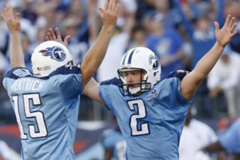 Rob Bironas, right, celebrates after he slots over his 47-yard field goal in overtime against the Green Bay Packers.