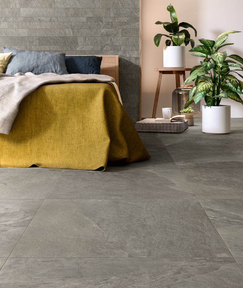 Reconnect with nature even indoors by opting for earthy materials such as a slate wall, and plenty of indoor plants. Photo: Porcelain Superstore