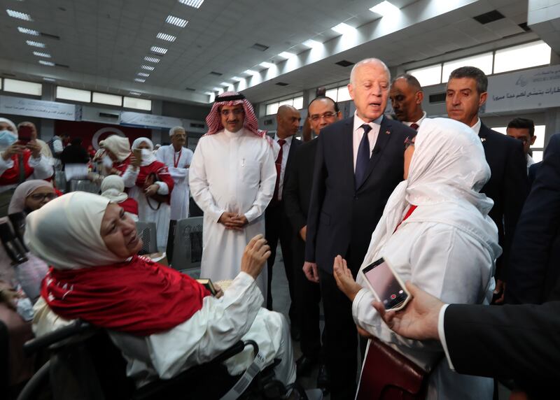 Tunisian President Kais Saied greets some of those heading for Makkah. EPA