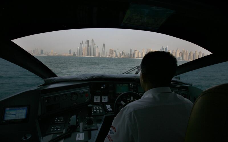 Dubai, United Arab Emirates, July 25b 2011, Jonathan Gornall Story, RTA Water Taxi-A view of the JBR and Dubai Pearl area is visible through the winshild of the RTA Water Taxi as Skipper James Daguia returns to the Dubai Marina area..  Mike Young / The National