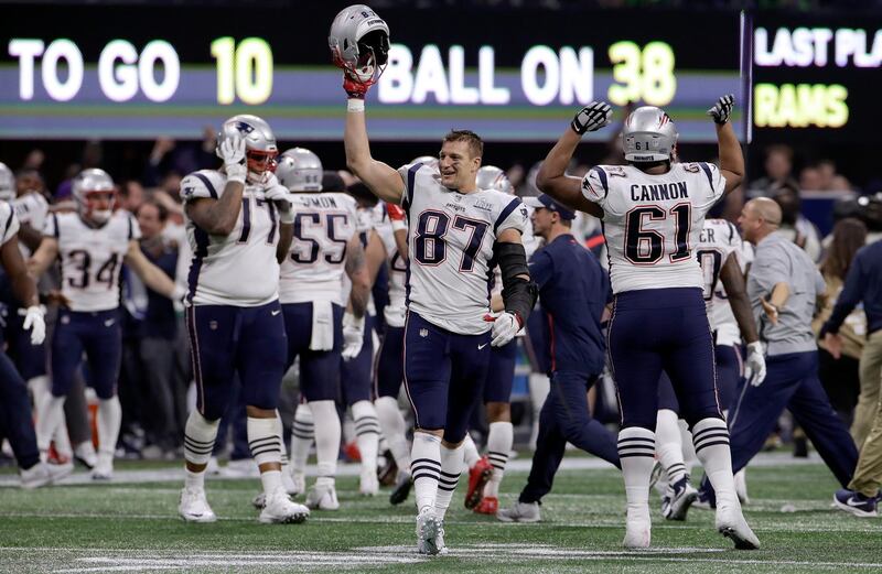The Patriots' Rob Gronkowski (87) celebrates with teammates after Super Bowl LIII had been won. Reuters