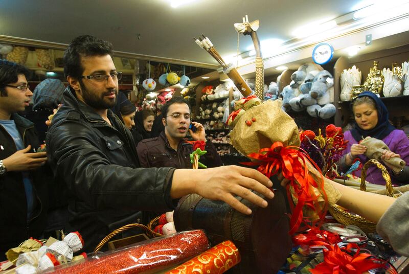 EDITORS' NOTE: Reuters and other foreign media are subject to Iranian restrictions on leaving the office to report, film or take pictures in Tehran.

An Iranian man buys a gift during Valentine's day shopping at a shop in Tehran February 13, 2012. REUTERS/Raheb Homavandi  (IRAN - Tags: SOCIETY) *** Local Caption ***  TEH07_IRAN-_0213_11.JPG