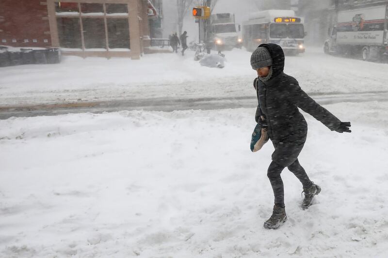 People struggle against wind and snow in Brooklyn, New York City. Brendan McDermid / Reuters