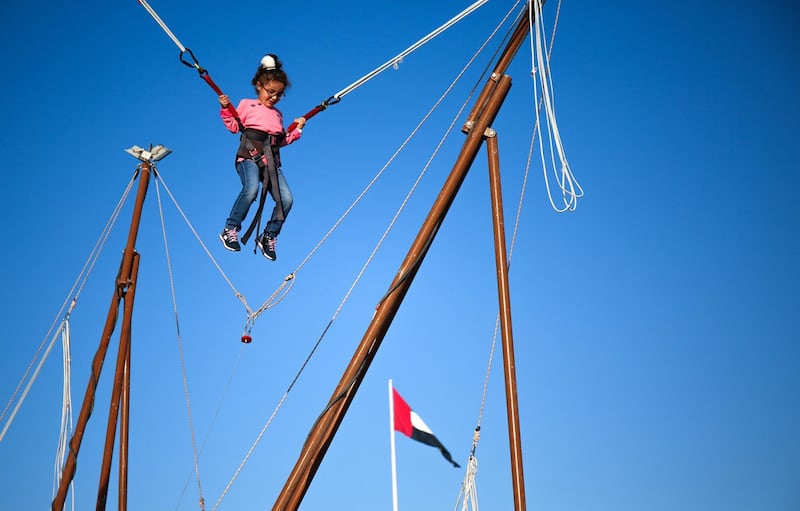 Abu Dhabi, United Arab Emirates, December 31, 2017.   New Year's Eve At the Abu Dhabi New Year's Eve Village.  A little girl enjoys the bungee jump play area.
Victor Besa for The National.
National
Reporter:  John Dennehy