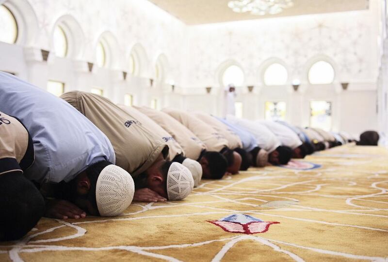 Worshippers started off the first day of fasting with an early morning prayer at the Grand Mosque in Abu Dhabi. Lee Hoagland/ The National