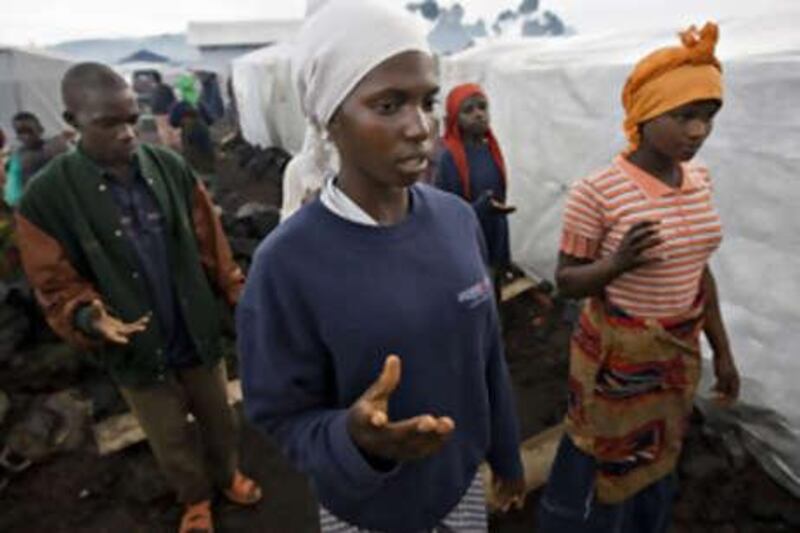People displaced by fighting, pray at a makeshift camp in Kibati in eastern Congo.