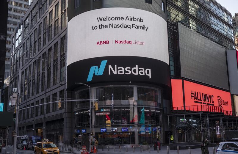 Airbnb Inc. signage on an electronic monitor during the company's initial public offering (IPO) at the Nasdaq MarketSite in New York, U.S., on Thursday, Dec. 10, 2020. Airbnb Inc. priced its long-awaited initial public offering above a marketed range to raise about $3.5 billion, seizing on investor demand for a home-rental business roaring back from a pandemic-fueled slump. Photographer: Victor J. Blue/Bloomberg