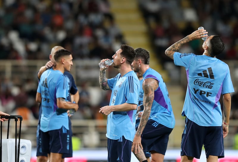 Argentina's Lionel Messi with teammates in Abu Dhabi.