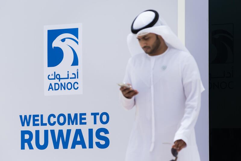 An official uses his smartphone as he arrives for a tour of the Ruwais refinery and petrochemical complex, operated by Abu Dhabi National Oil Co. (ADNOC), in Al Ruwais, United Arab Emirates, on Monday, May 14, 2018. Adnoc is seeking to create world’s largest integrated refinery and petrochemical complex at Ruwais. Photographer: Christophe Viseux/Bloomberg