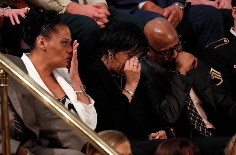 Elizabeth Alvarado, Robert Mickens, Evelyn Rodriguez, and Freddy Cuevas, parents of two girls who were chased down and brutally murdered and whose deaths were among a string of 17 Long Island slayings that have been attributed to Mara Salvatrucha, also known as MS-13, cry as US President Donald Trump introduces them during his State of the Union address.