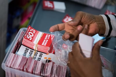 An employee organizes discount labels ahead of Black Friday at a J.C. Penney Co. store in the Queens borough of New York, U.S., on Monday, Nov. 20, 2017. Traditional retailers may be able to breathe a (brief) sigh of relief this weekend. Only 47 percent of U.S. consumers plan to shop online during this year's Black Friday, the post-Thanksgiving sales bonanza that kicks off the holiday season, according to a survey from Deloitte LP. Photographer: Mark Kauzlarich/Bloomberg