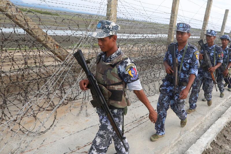 epa06574017 (FILE) - Myanmar border guard police officers patrol along a beach near a makeshift camp at the Myanmar-Bangladesh border, near the town of Maungsaw, Rakhine State, western Myanmar, 12 November 2017 (reissued 02 March 2018). According to media reports, the Myanmar military has defended on 02 March 2018, its decision to deploy fresh troops near the shared border with neighboring Bangladesh, blaming a militant threat. Earlier Dhaka asked Myanmar to pull back its soldiers from the border area near a refugee camp where more than 5,000 Rohingya refugees have been living. The Rohingya crisis started in August 2017, when Rohingya militants launched a series of attacks on multiple Myanmar government posts in the region, leading the army to unleash a large military campaign that drove around 700,000 Rohingyas across the border.  EPA/HEIN HTET