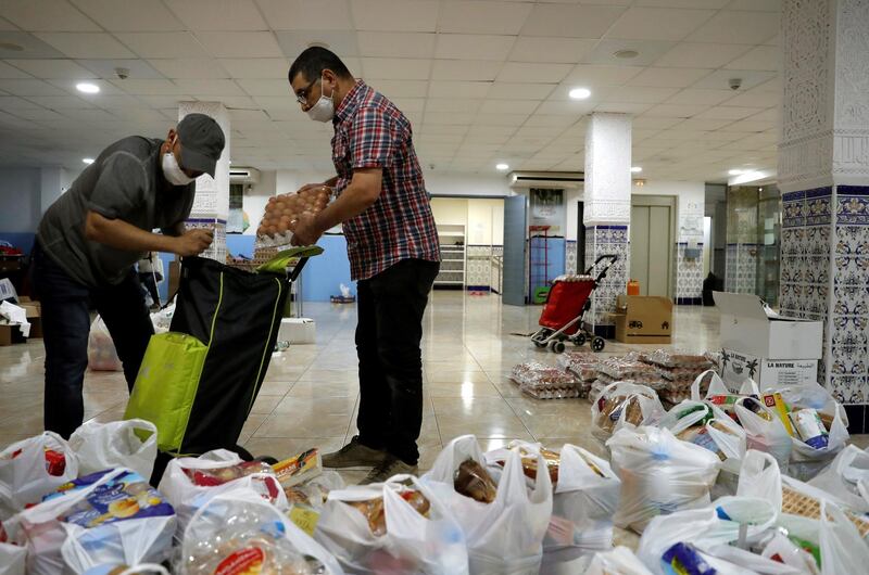 Volunteers with the Catalan Islamic Cultural Center of Barcelona prepare packages of food to be delivered during the Eid al-Fitr holidays in Barcelona, Catalonia, Spain. EPA