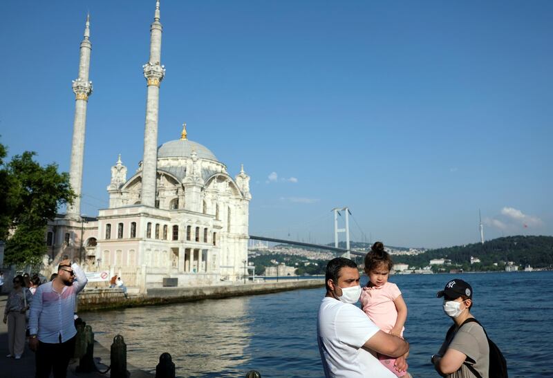 A family stand by the Bosphorus in Istanbul, Turkey. Reuters