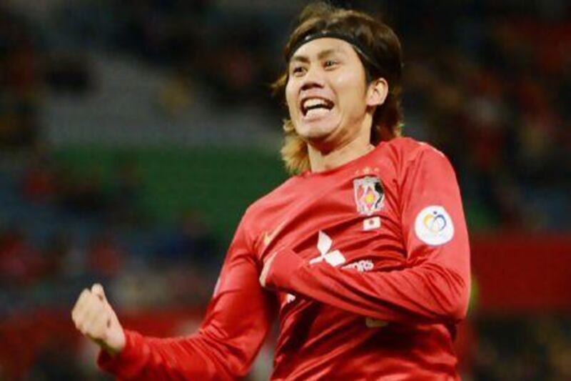 Japan's Urawa Red Diamonds midfielder Yosuke Kashiwagi celeberates his opening goal against Thailand's Muangthong United.