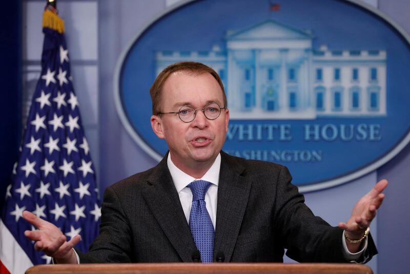 FILE PHOTO: White House budget director Mick Mulvaney gestures as he holds a press briefing at the White House in Washington, U.S., January 19, 2018. REUTERS/Kevin Lamarque/File Photo