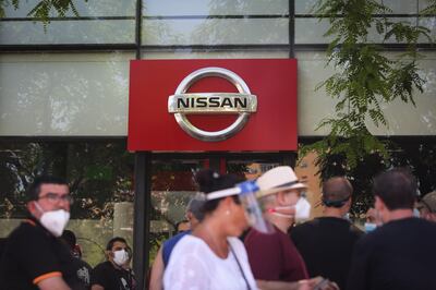 Demonstrators gather to protest outside the Nissan Motor Co. Motor Llansa dealership showroom in Barcelona, Spain, on Thursday, May 28, 2020. Nissan said it intends to close its Barcelona plant, in addition to the one it is planning to shutter in Indonesia. Photographer: Angel Garcia/Bloomberg