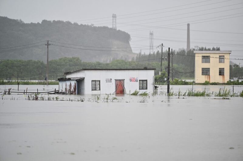 Floodwaters surround a building in Yuyao near the city of Ningbo in eastern China's Zhejiang province.