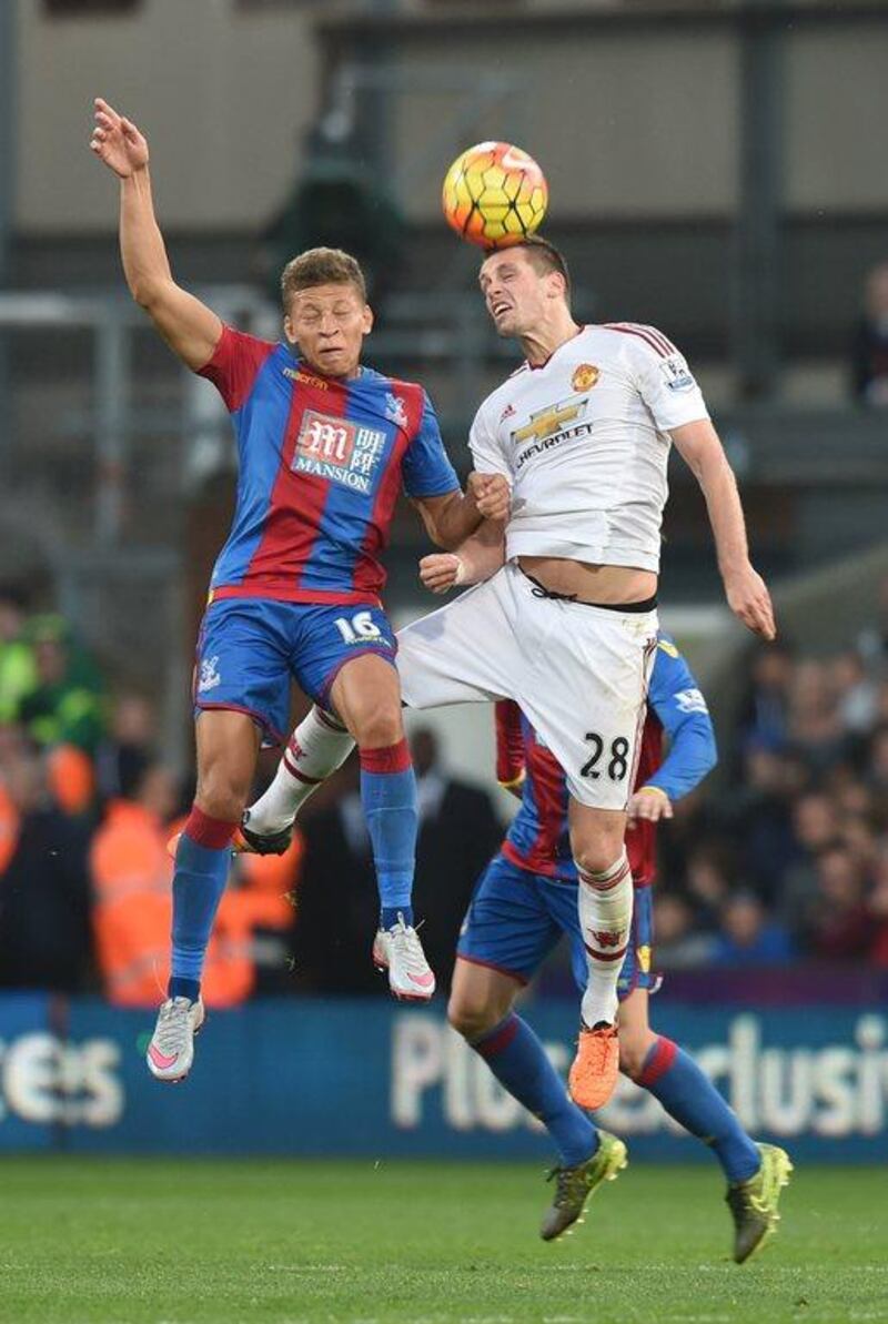Crystal Palace's Dwight Gayle, left, vies with Manchester United's Morgan Schneiderlin during their English Premier League match at Selhurst Park in south London on October 31, 2015. The game finished 0-0. AFP PHOTO / OLLY GREENWOOD
