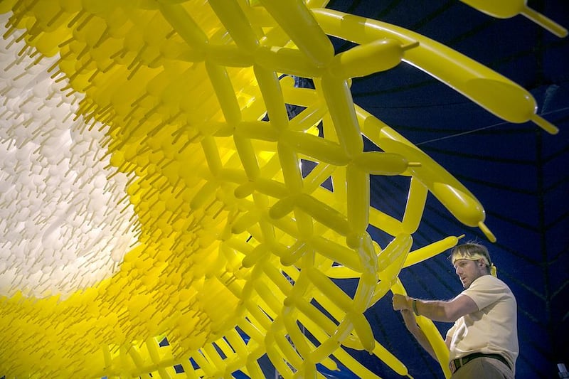 The balloon artist Jason Hackenwerth weaving Corona for Abu Dhabi Science Festival. Silvia Razgova / The National