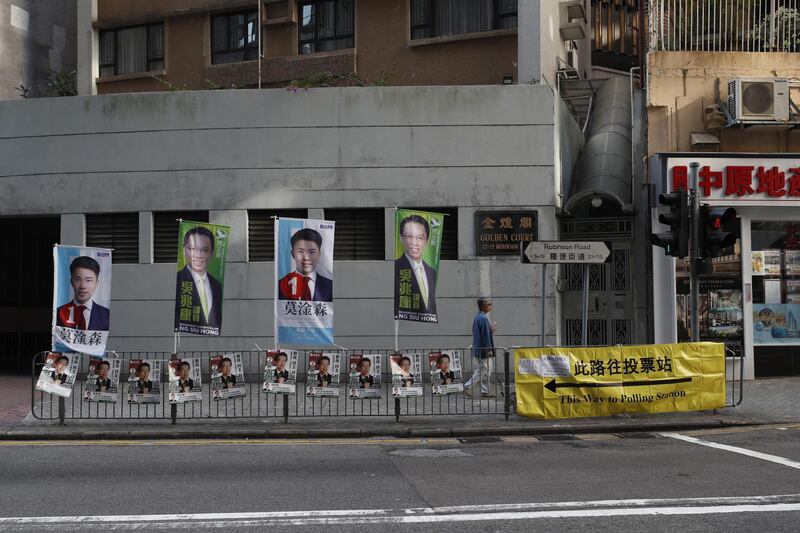 Posters for candidates in the District Council election stand on a street in Hong Kong, China. EPA