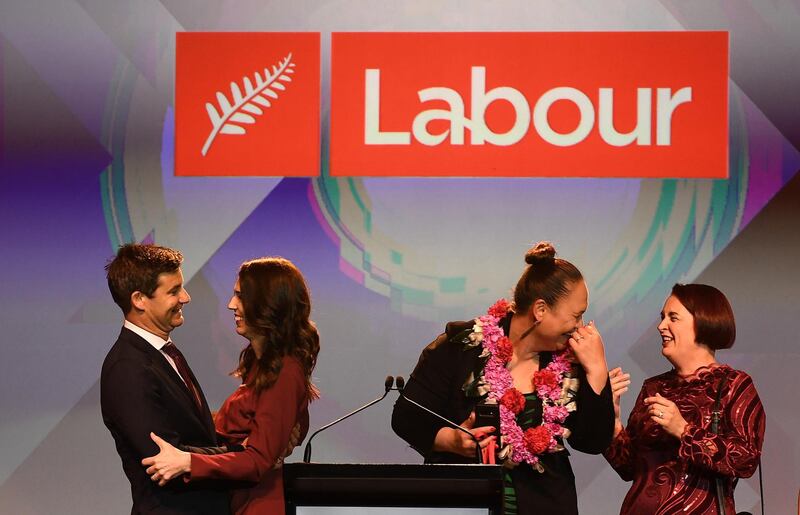 Labour Party leader and New Zealand Prime Minister Jacinda Ardern and her finance Clarke Gayford look on after she claimed victory during the election night function. Getty Images