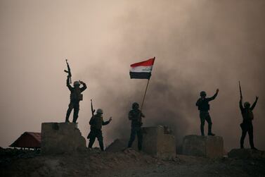 Members of the paramilitary Popular Mobilisation Forces at a military camp in Kerbala, Iraq. Reuters