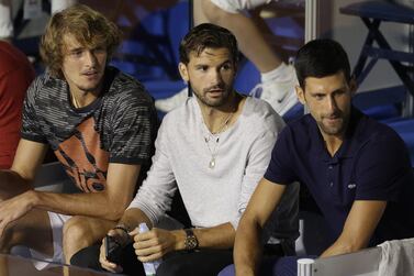 epa08485621 (L-R) Alexander Zverev of Germany,Grigor Dimitrov of Bulgaria and Novak Djokovic of Serbia watch the final match between Filip Krajinovic of Serbia and Dominic Thiem of Austria at the Adria Tour tennis tournament in Belgrade, Serbia, 14 June 2020. The Adria Tour will be held until 05 July in a number of Balkan countries. EPA/ANDREJ CUKIC