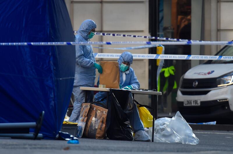 LONDON, ENGLAND - NOVEMBER 30: Forensic officers investigate the scene of yesterday's London Bridge stabbing attack on November 30, 2019 in London, England. A man and a woman were killed and three seriously injured in a stabbing attack at London Bridge during which the suspect was shot dead by Police officers after members of the public restrained him. The Metropolitan Police have named the suspect as 28-year-old Usman Khan.  (Photo by Peter Summers/Getty Images)