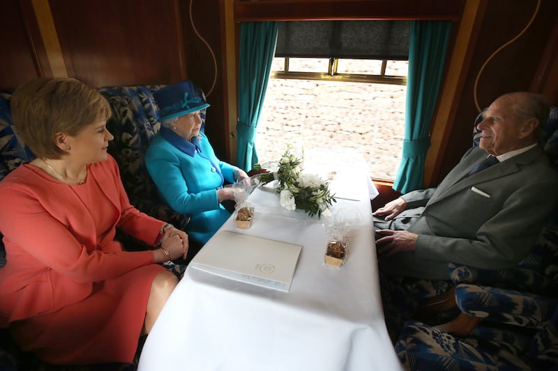 First Minister of Scotland Nicola Sturgeon, Queen Elizabeth and Prince Philip on board the steam locomotive 'Union of South Africa' in 2015, in Edinburgh.