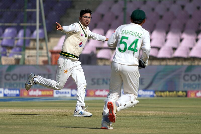 Pakistan's Abrar Ahmed, left, celebrates after taking the catch of New Zealand's Tom Latham. AP 