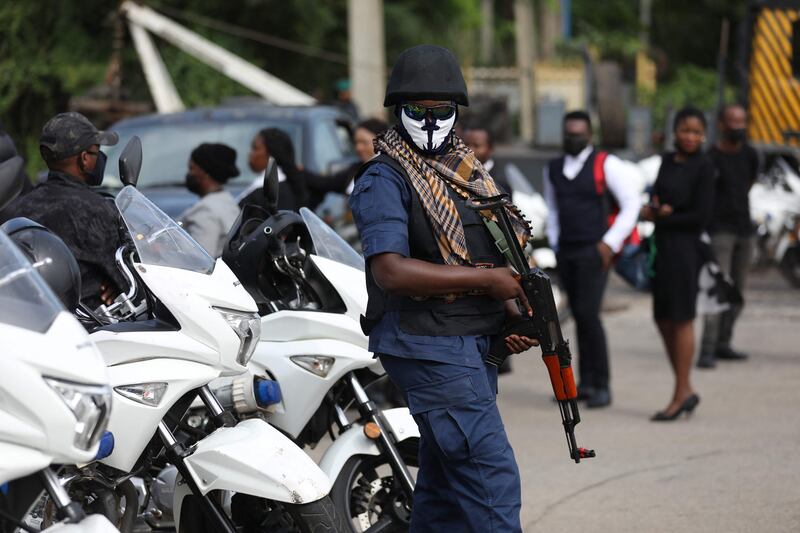 A Nigeria State Secret Police officer is seen outside a Federal High Court. Photo: AFP