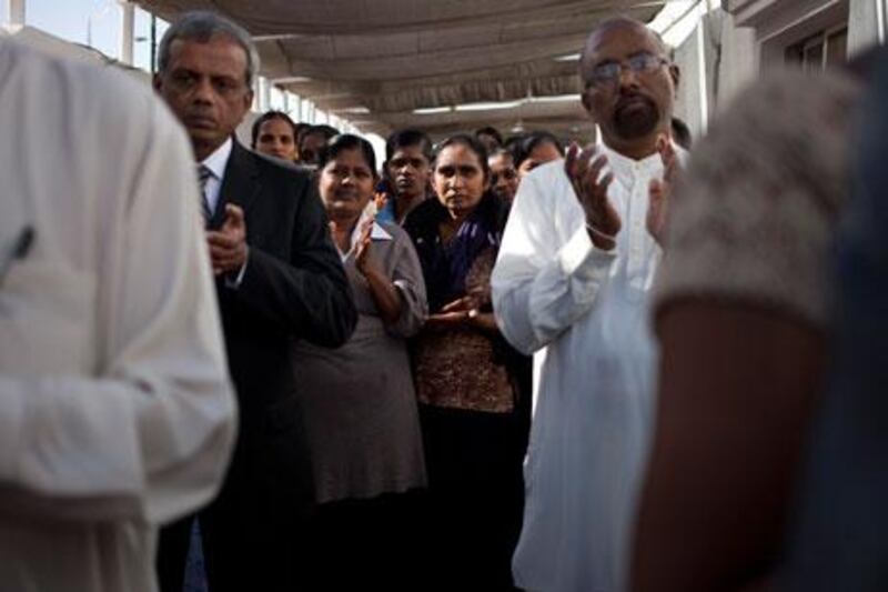 Dubai, United Arab Emirates - February 03 2012- Sri Lankan expats pray at a ceremony marking Sri Lanka's 65th Celebration of Independence at the consulate in Dubai. (Razan Alzayani / The National)  